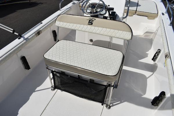 Slide: The Image of 2021 Carolina Skiff 19 LS boat interior with cushioned seating and steering console. - 32