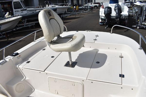Slide: The Image of 2021 Carolina Skiff 19 LS boat deck with swivel seat and storage compartments. - 41