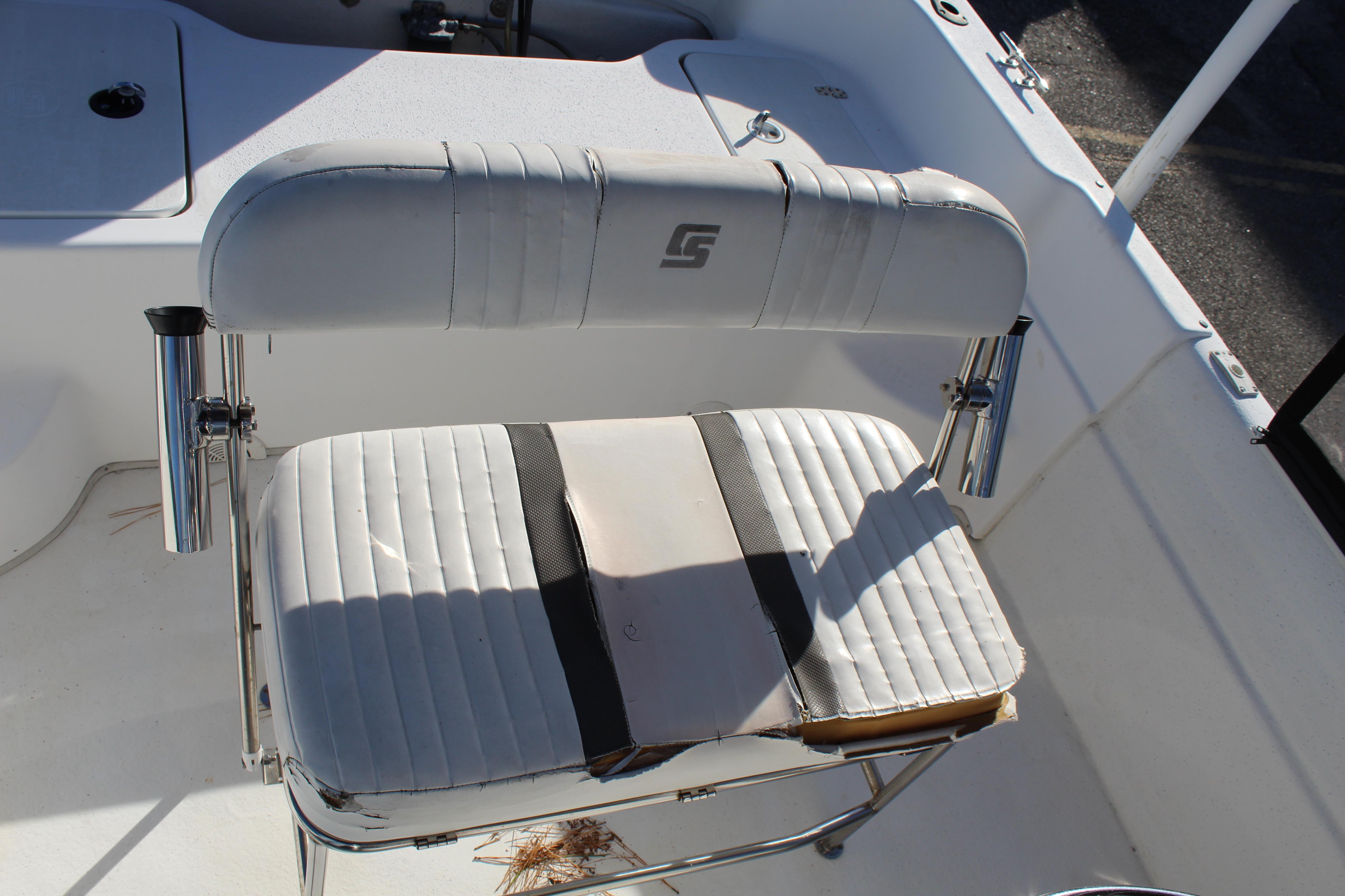 Slide: The Image of 2011 Carolina Skiff 218 DLV boat seat with rod holders, white upholstery. - 12