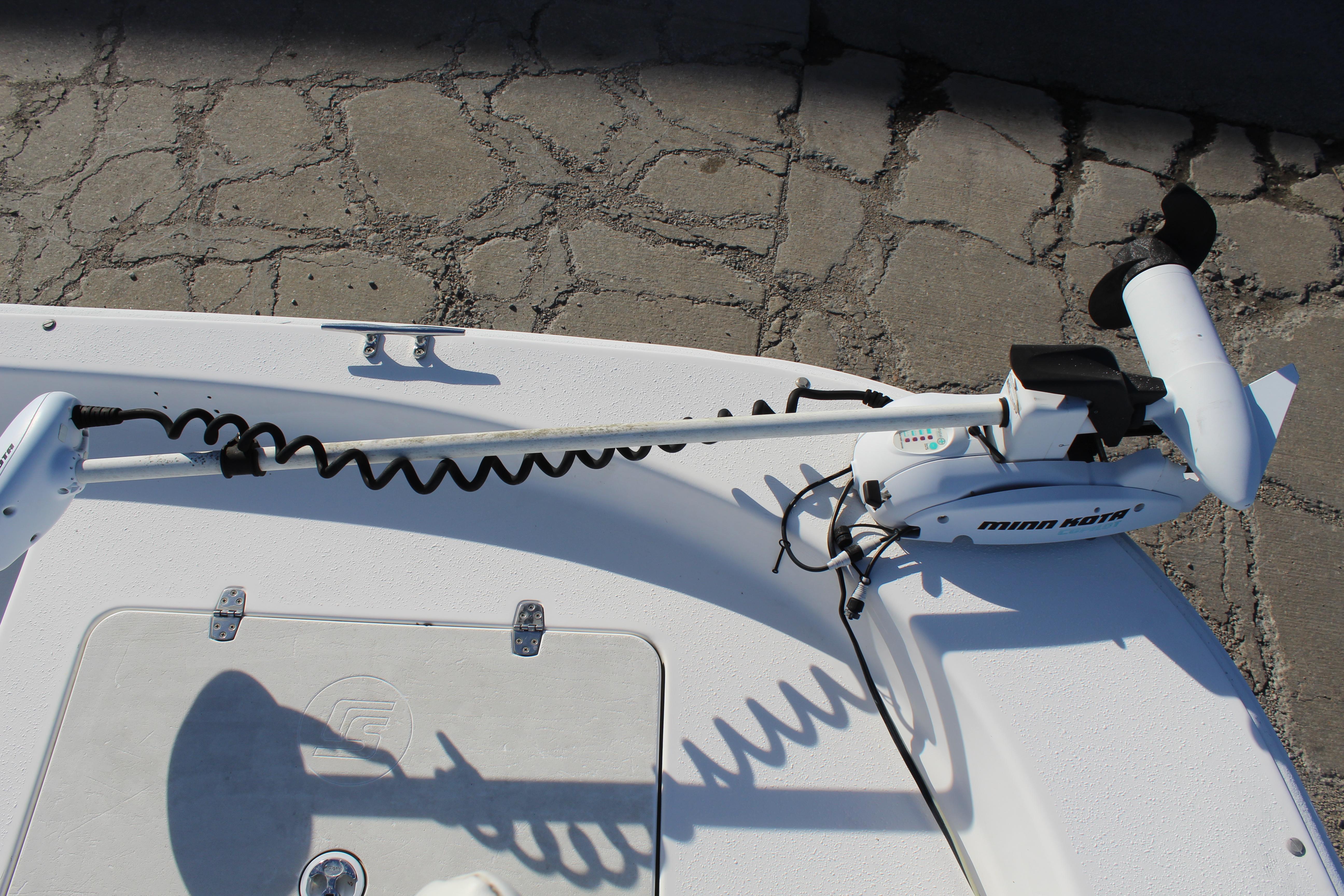 Slide: The Image of Minn Kota trolling motor on 2011 Carolina Skiff 218 DLV boat deck. - 19