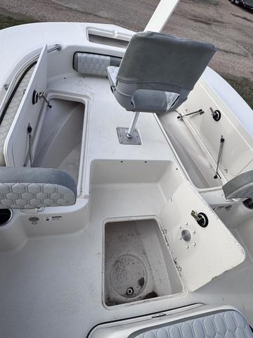 Slide: The Image of 2025 Carolina Skiff 22 Ultra Elite boat interior with storage compartments and seating. - 10