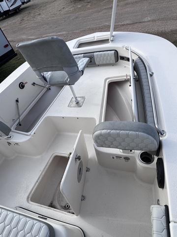 Slide: The Image of 2025 Carolina Skiff 22 Ultra Elite boat interior with seating and storage compartments. - 11