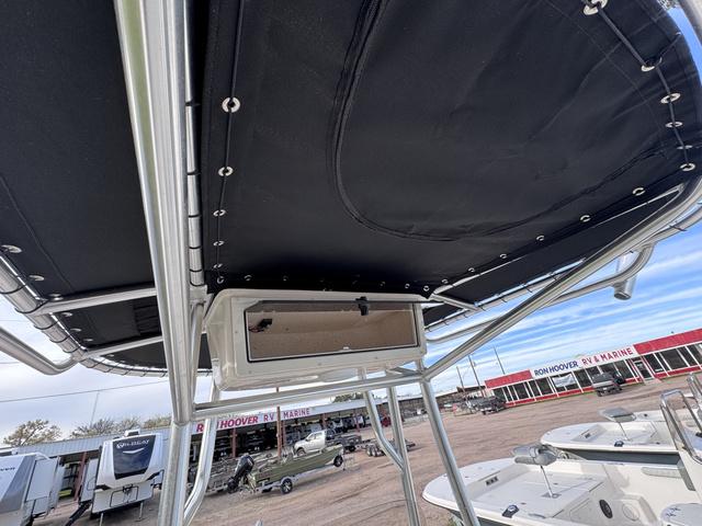 Slide: The Image of 2025 Carolina Skiff 22 Ultra Elite boat with T-top and storage compartment. - 15