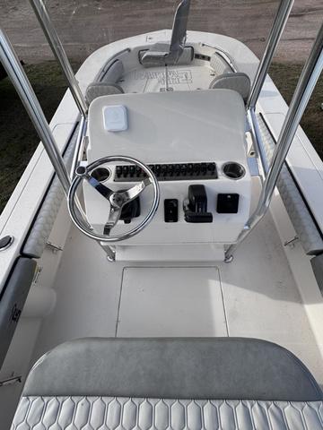Slide: The Image of 2025 Carolina Skiff 22 Ultra Elite boat console with steering wheel and seating. - 16