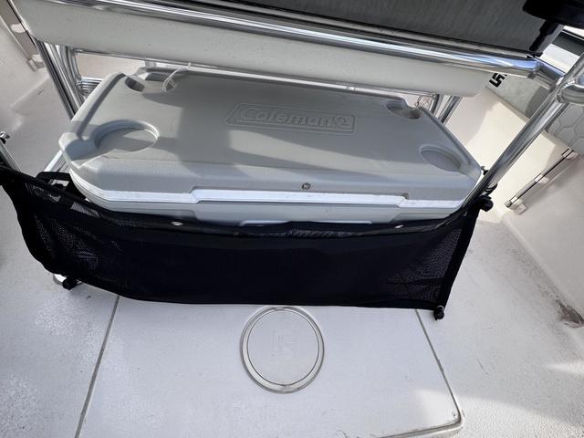 Slide: The Image of 2025 Carolina Skiff 22 Ultra Elite boat with Coleman cooler storage. - 18