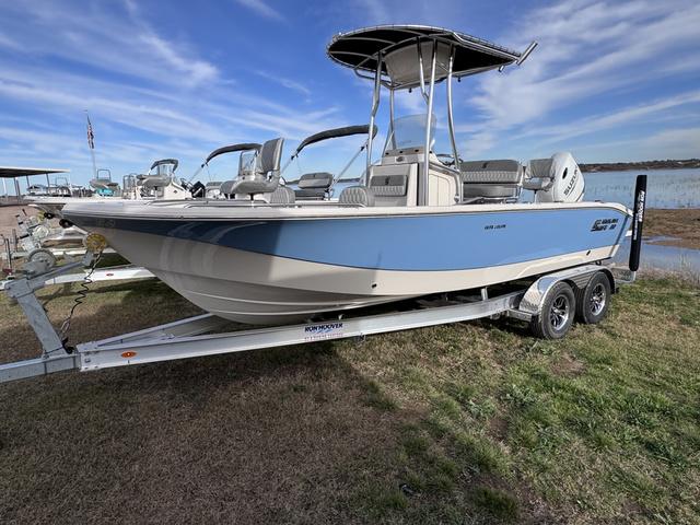 Slide: The Image of 2025 Carolina Skiff 22 Ultra Elite boat on trailer by lakeside. - 2