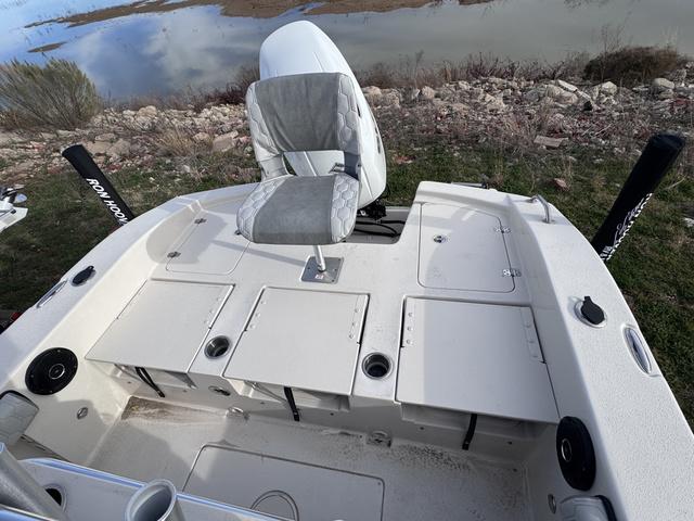 Slide: The Image of 2025 Carolina Skiff 22 Ultra Elite boat interior with seating and storage compartments. - 22