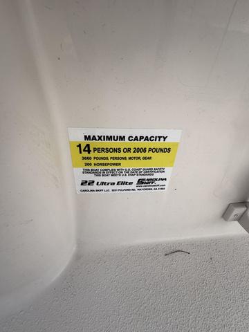 Slide: The Image of 2025 Carolina Skiff 22 Ultra Elite capacity label: 14 persons or 2006 pounds. - 23