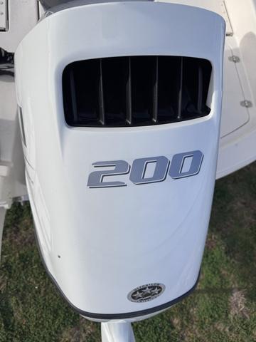 Slide: The Image of 2025 Carolina Skiff 22 Ultra Elite outboard motor, 200 horsepower, close-up view. - 4