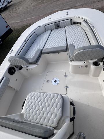 Slide: The Image of 2025 Carolina Skiff 22 Ultra Elite boat interior with cushioned seating and modern design. - 5