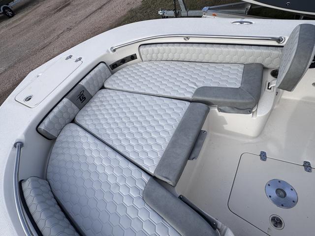 Slide: The Image of 2025 Carolina Skiff 22 Ultra Elite boat with cushioned seating and sleek design. - 7