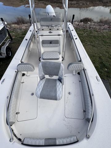 Slide: The Image of 2025 Carolina Skiff 22 Ultra Elite boat interior with gray seating and spacious deck. - 8