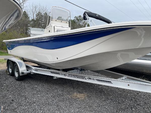 Slide: The Image of 2024 Carolina Skiff 23 LS boat on a trailer, side view. - 0
