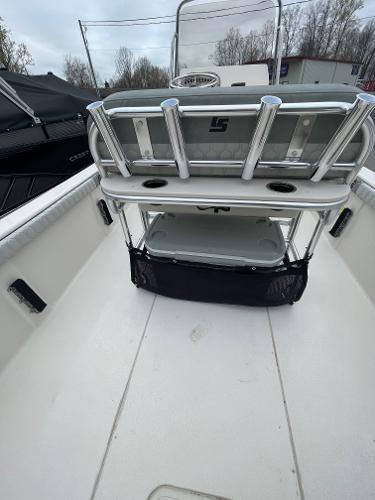 Slide: The Image of 2024 Carolina Skiff 23 LS boat interior with rod holders and storage. - 3