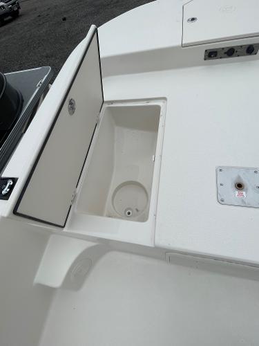 Slide: The Image of 2024 Carolina Skiff 23 LS boat storage compartment and deck details. - 8