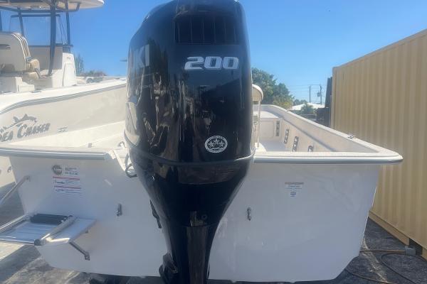 Slide: The Image of 2024 Carolina Skiff e24 DLX boat with Suzuki 200 outboard motor. - 2