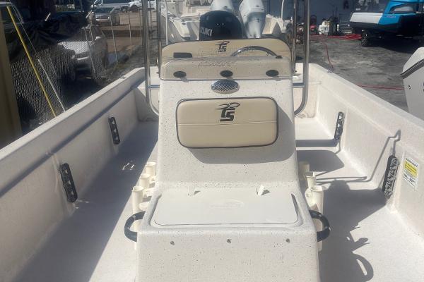 Slide: The Image of 2024 Carolina Skiff e24 DLX boat interior with steering console and seating. - 5