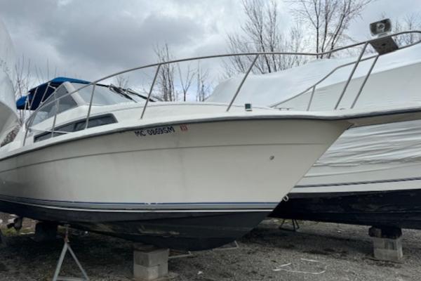 Slide: The Image of 1993 Carver 280 Express boat on dry dock, side view. - 2