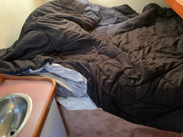 Slide: The Image of Interior of 1986 Carver 28 Riviera with bed and sink. - 7