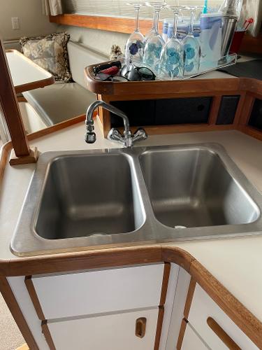 Slide: The Image of 1988 Carver 32 Mariner kitchen sink with double basins and countertop. - 10