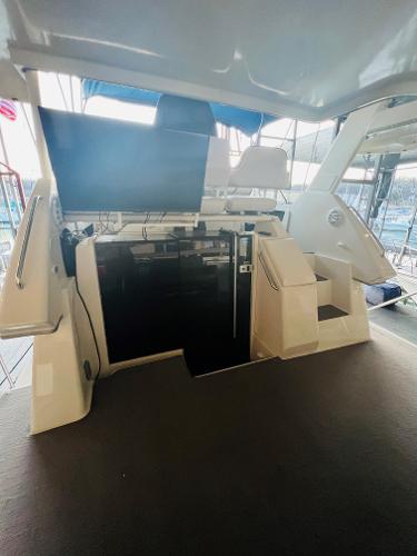 Slide: The Image of 1994 Carver 350 Aft Cabin interior with modern seating and spacious layout. - 20