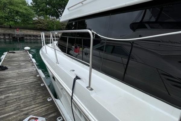 Slide: The Image of 2002 Carver 356 Motor Yacht docked beside wooden pier. - 11