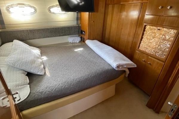 Slide: The Image of Cozy bedroom in 2002 Carver 356 Motor Yacht with wood cabinetry and modern decor. - 14