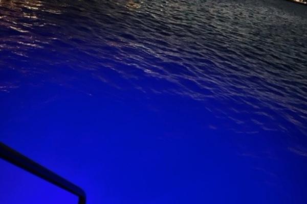 Slide: The Image of Night view of water illuminated by blue lights from a 2002 Carver 356 Motor Yacht. - 17
