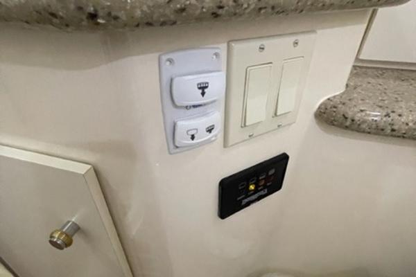 Slide: The Image of Control panel on 2002 Carver 356 Motor Yacht interior with switches and buttons. - 19