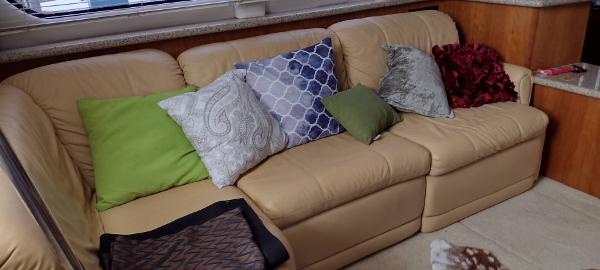 Slide: The Image of Beige leather sofa with colorful cushions in 2002 Carver 356 Motor Yacht interior. - 34