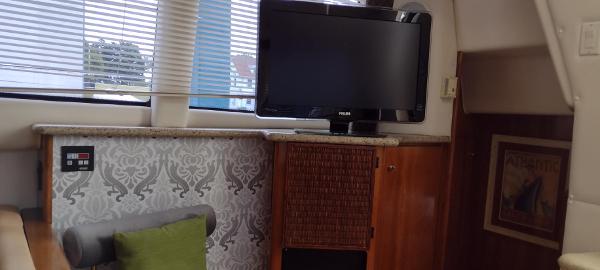 Slide: The Image of Interior of 2002 Carver 356 Motor Yacht with TV and stylish decor. - 36