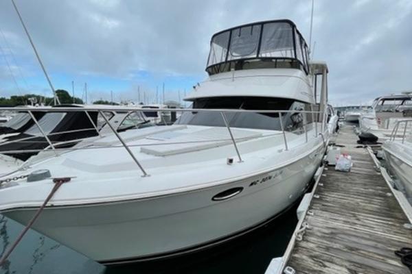 Slide: The Image of 2002 Carver 356 Motor Yacht docked at marina under cloudy sky. - 8