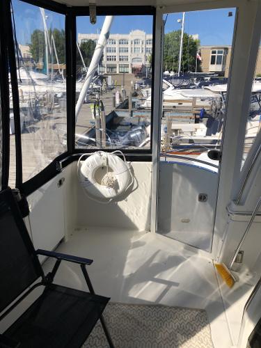 Slide: The Image of 2004 Carver 366 Motor Yacht aft deck with marina view. - 15