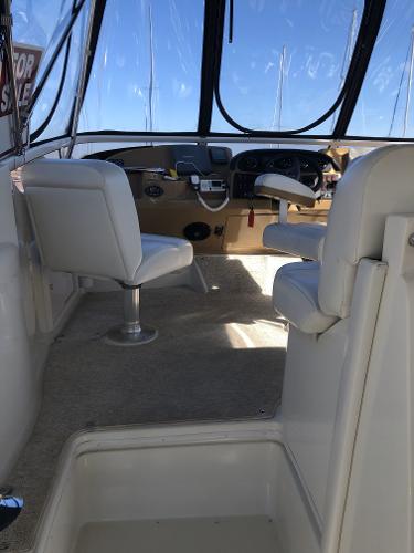 Slide: The Image of 2004 Carver 366 Motor Yacht cockpit with helm and seating. - 16