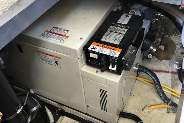 Slide: The Image of 2004 Carver 366 Motor Yacht engine room with Kohler generator. - 21