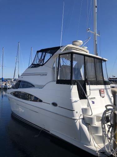 Slide: The Image of 2004 Carver 366 Motor Yacht docked at a marina. - 4