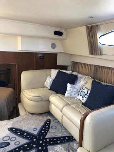 Slide: The Image of Interior of 2004 Carver 366 Motor Yacht with cozy seating area. - 5