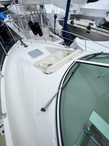 Slide: The Image of 2006 Carver 36 Mariner yacht deck with white railing and windshield. - 11