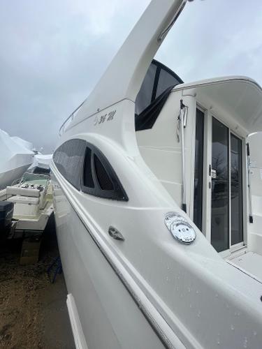 Slide: The Image of 2006 Carver 36 Mariner yacht, side view with sleek white exterior. - 14