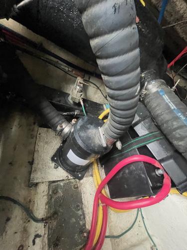Slide: The Image of Engine compartment of a 2006 Carver 36 Mariner with hoses and wiring. - 19