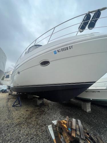 Slide: The Image of 2006 Carver 36 Mariner boat on dry dock with registration NJ 0558 GY. - 2