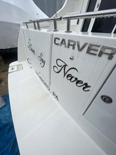 Slide: The Image of 2006 Carver 36 Mariner yacht stern with Never Say Never name. - 26