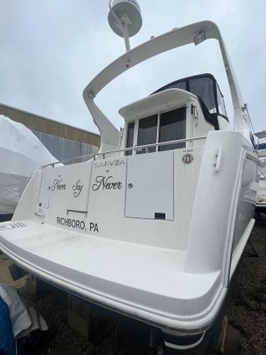 Slide: The Image of 2006 Carver 36 Mariner yacht docked, rear view, named Never Say Never, Richboro, PA. - 28