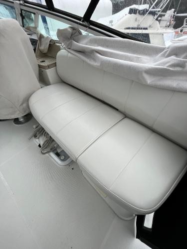 Slide: The Image of 2006 Carver 36 Mariner interior seating area with white leather upholstery. - 3
