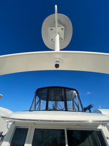 Slide: The Image of 2006 Carver 36 Mariner yacht with radar arch against blue sky. - 34