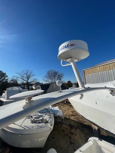 Slide: The Image of Carver 36 Mariner 2006 boat with radar equipment in a storage yard. - 35