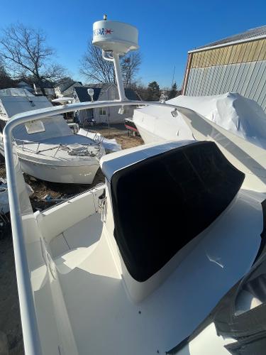 Slide: The Image of 2006 Carver 36 Mariner yacht with radar, docked in a marina. - 38