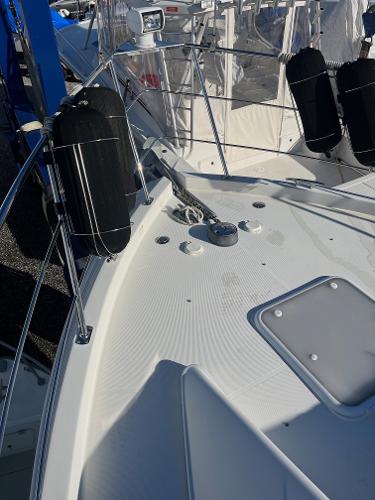 Slide: The Image of 2006 Carver 36 Mariner boat deck with anchor and fenders. - 42