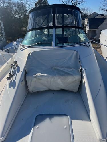Slide: The Image of 2006 Carver 36 Mariner boat with covered seating area on deck. - 44