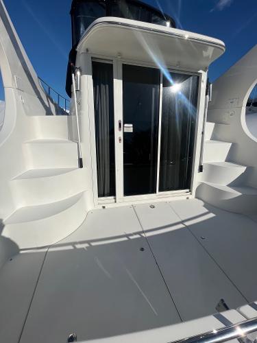 Slide: The Image of 2006 Carver 36 Mariner yacht with spacious deck and sliding glass doors. - 47
